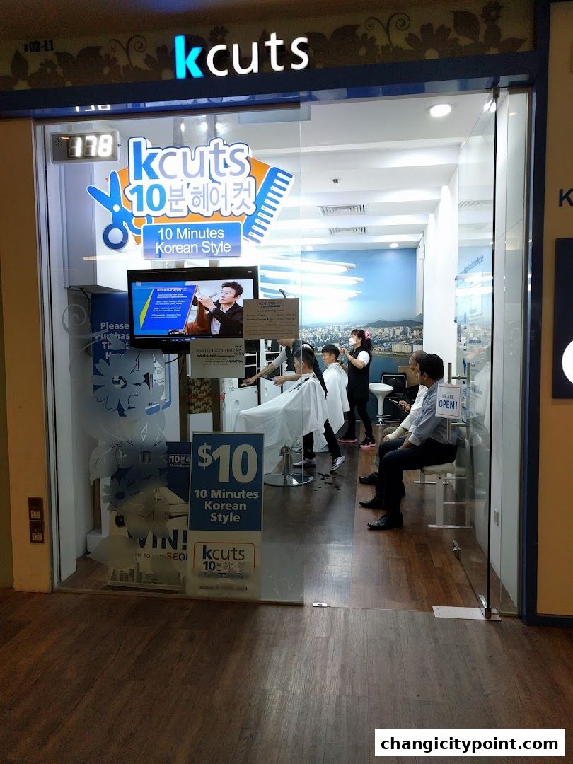 The entrance of a kcuts hair salon offering 10-minute Korean style haircuts.