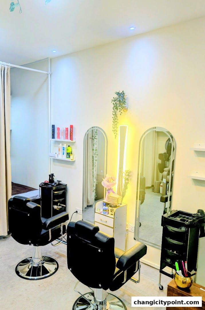 Interior of a modern salon with styling chairs, mirrors, and shelves with products.