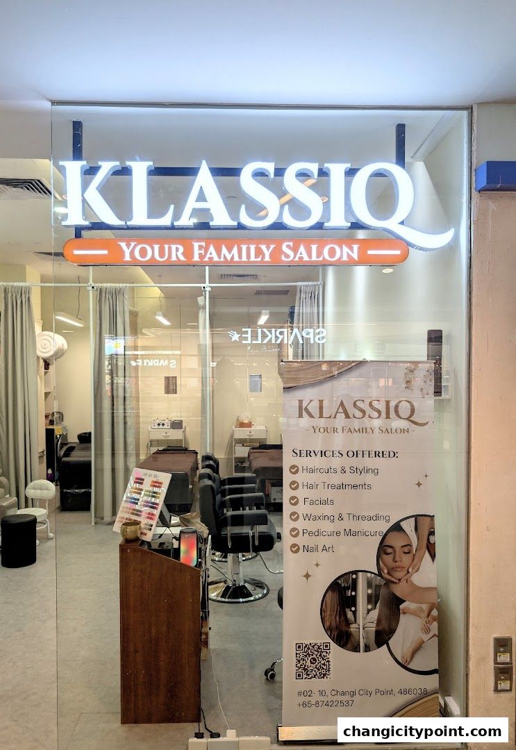 The entrance of Klassiq, a family salon, showcasing its services and inviting interior.