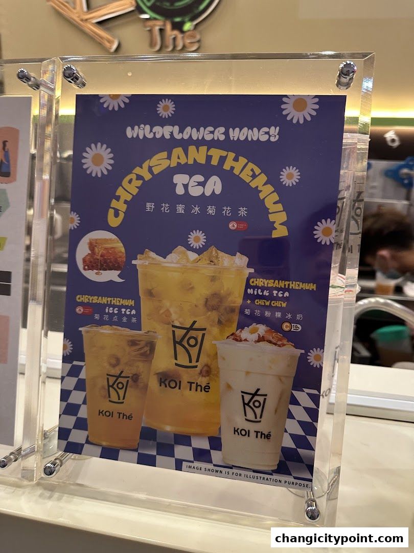 A menu display for KOI The's Wildflower Honey Chrysanthemum Tea.