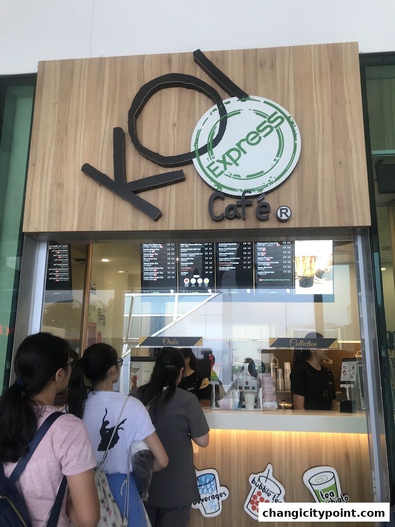 KOI Express Cafe storefront with a menu board and customers queuing.