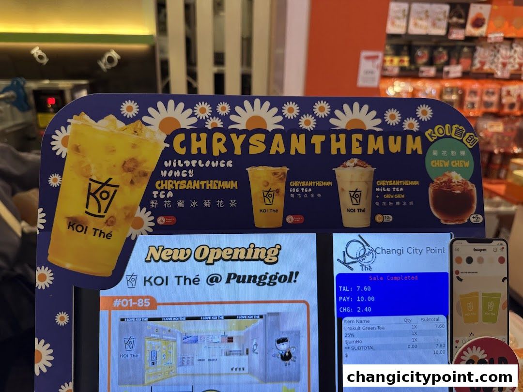 A display showcasing KOI The's Chrysanthemum drinks and a transaction screen.