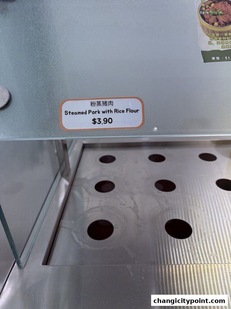 A close-up of a menu item for Steamed Pork with Rice Flour priced at $3.90.