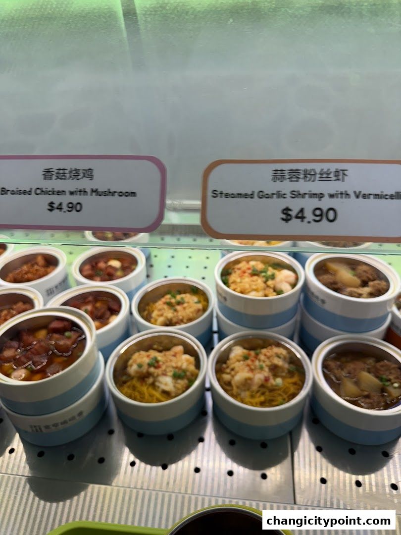 A display of pre-packaged meals with labels and prices.
