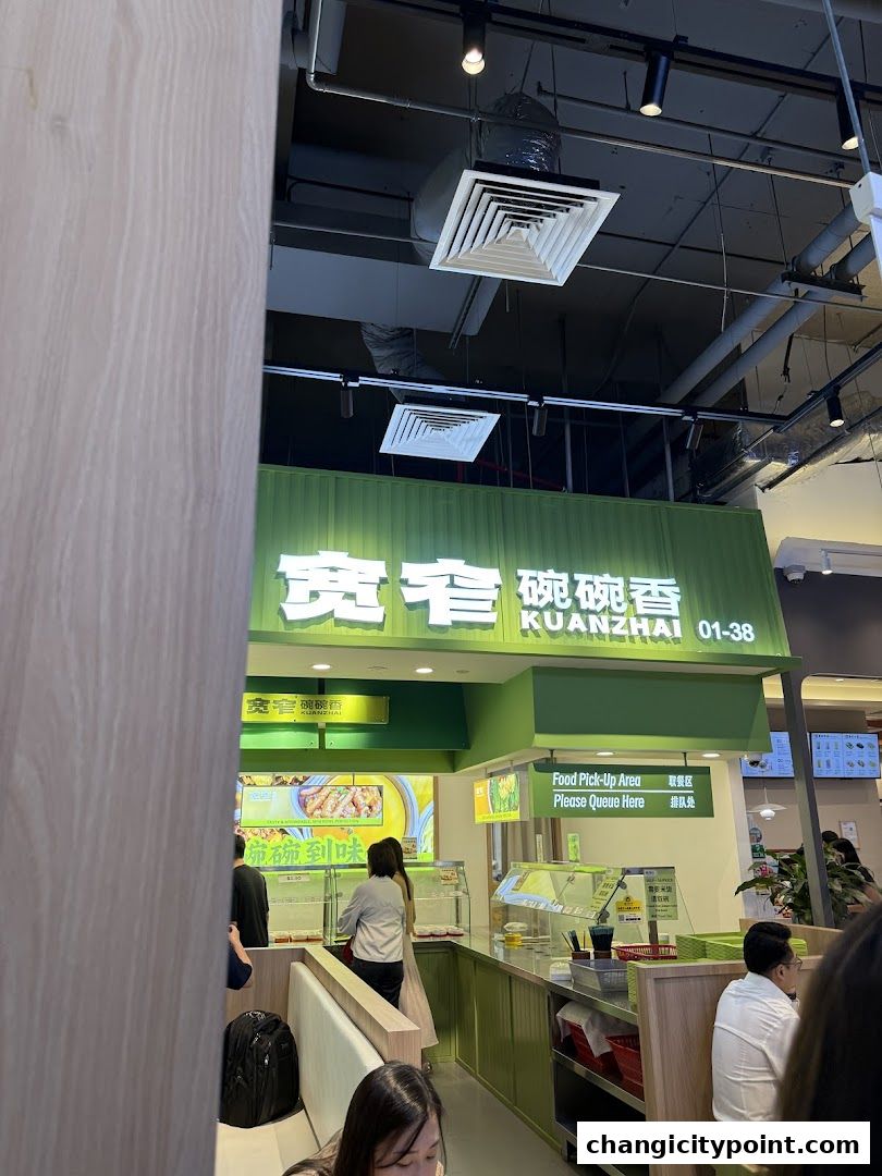 The entrance of a food stall named Kuan Zhai Wan Wan Xiang with a food pick-up area.