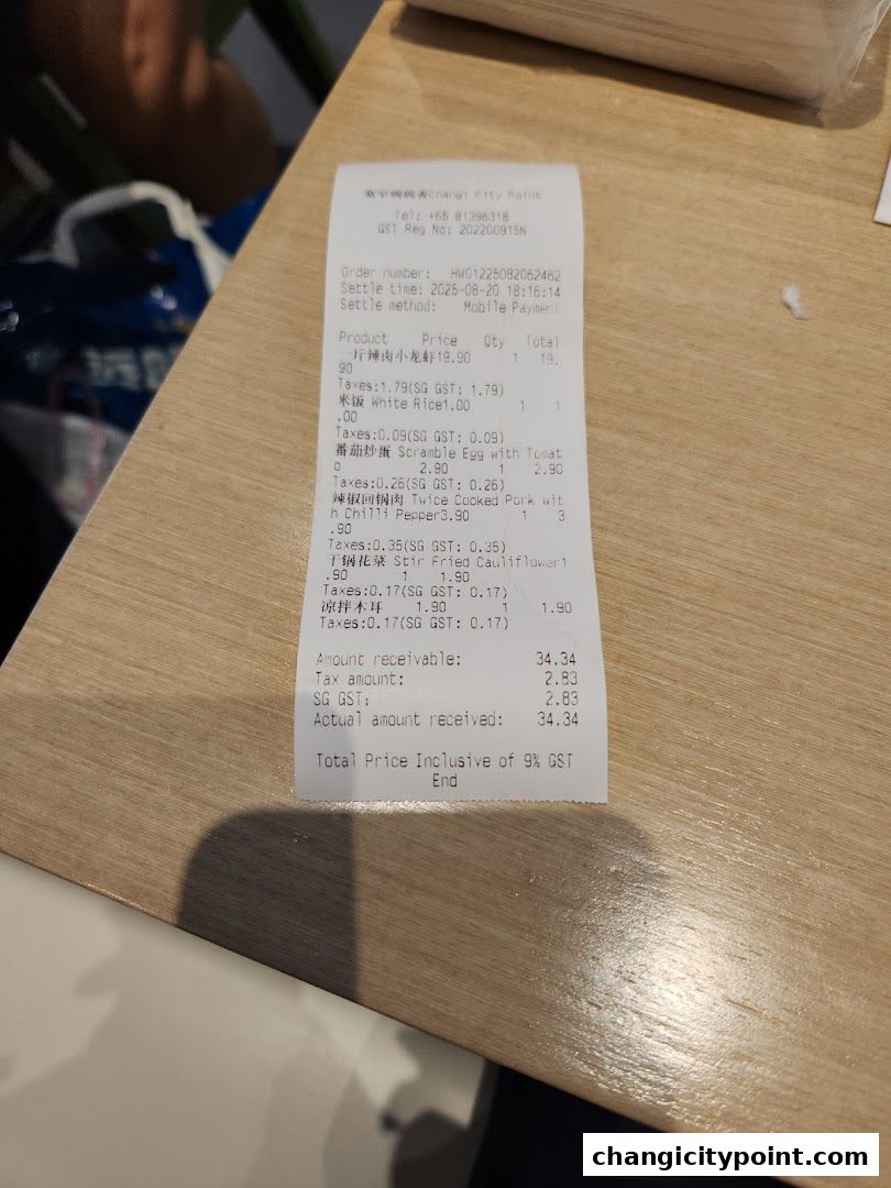 A receipt from Kuan Zhai Wan Wan Xiang showing food items and prices.