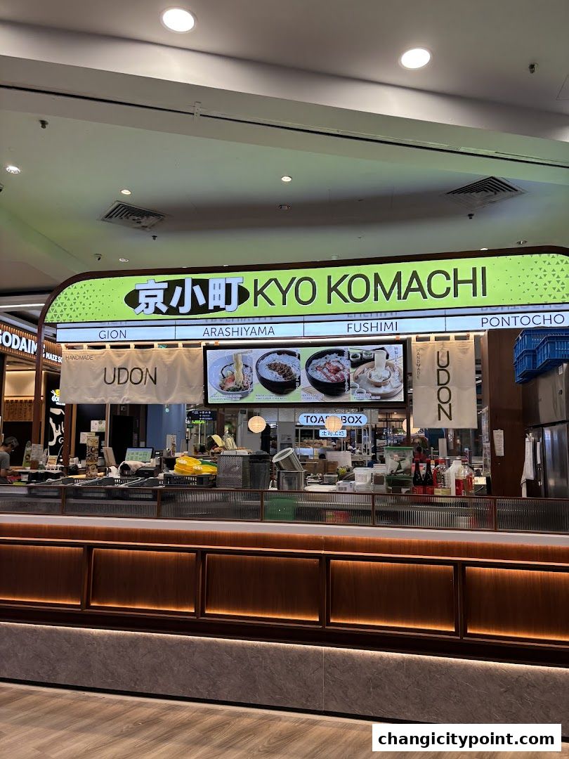 The exterior of Kyo Komachi, a Japanese restaurant, with its name and menu displayed.
