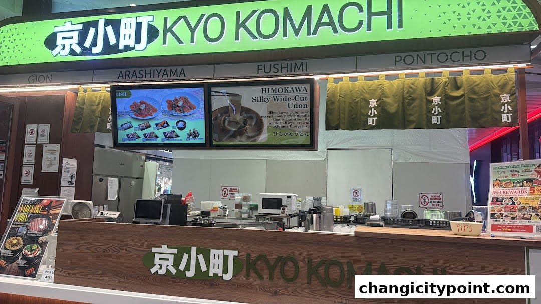 The exterior of Kyo Komachi, a Japanese restaurant, with its signage and food displays.