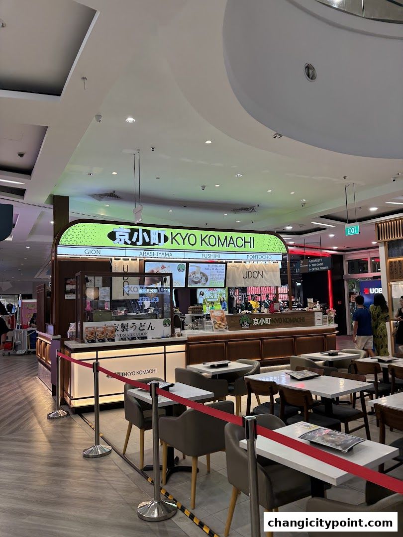 The exterior of Kyo Komachi, a Japanese Udon restaurant, with seating area.