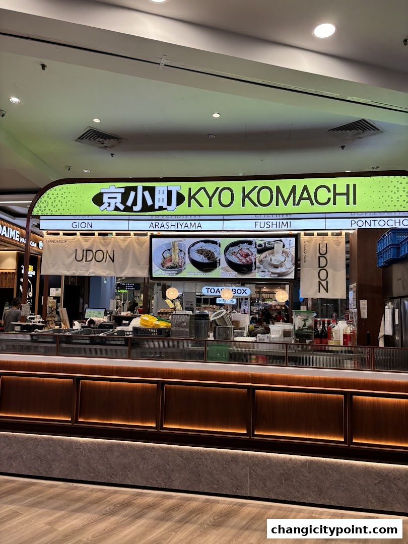 The exterior of Kyo Komachi, a Japanese restaurant, showcasing its signage and food display.