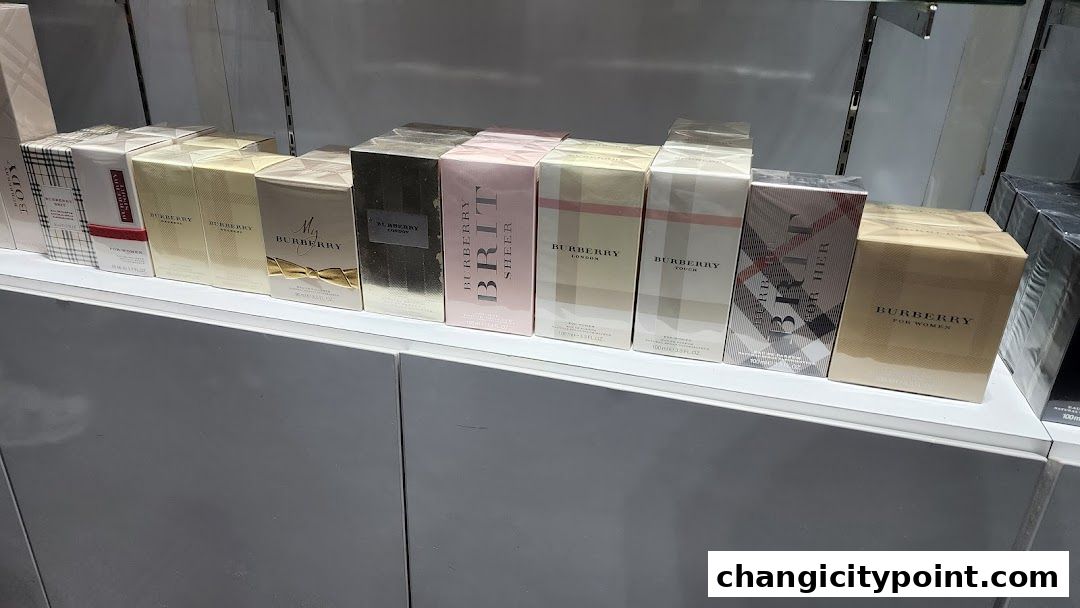 A display of various Burberry perfumes in their original packaging on a shelf.