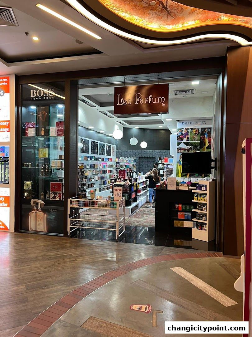 The entrance of Les Parfum, a fragrance shop, displaying various perfumes and brands.