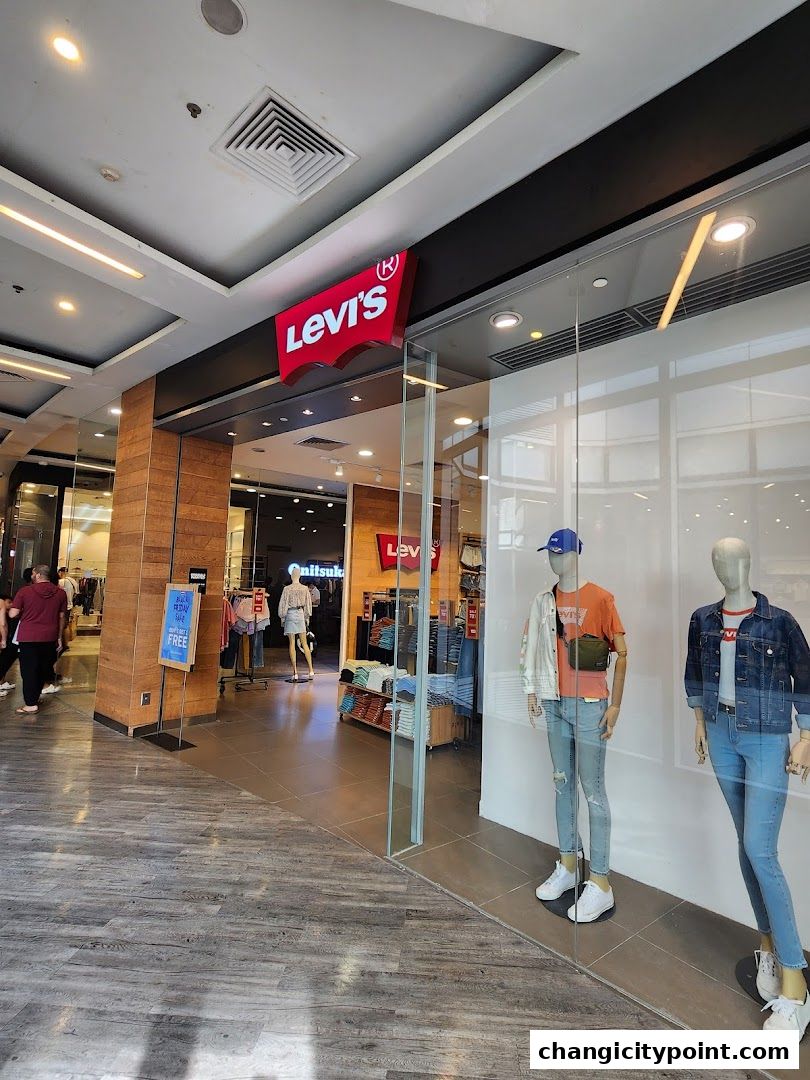 The entrance of a Levi's Outlet store with mannequins displaying jeans and jackets.