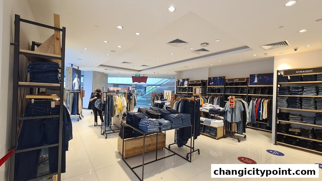 Interior view of a Levi's Outlet store showcasing stacks of jeans and apparel.