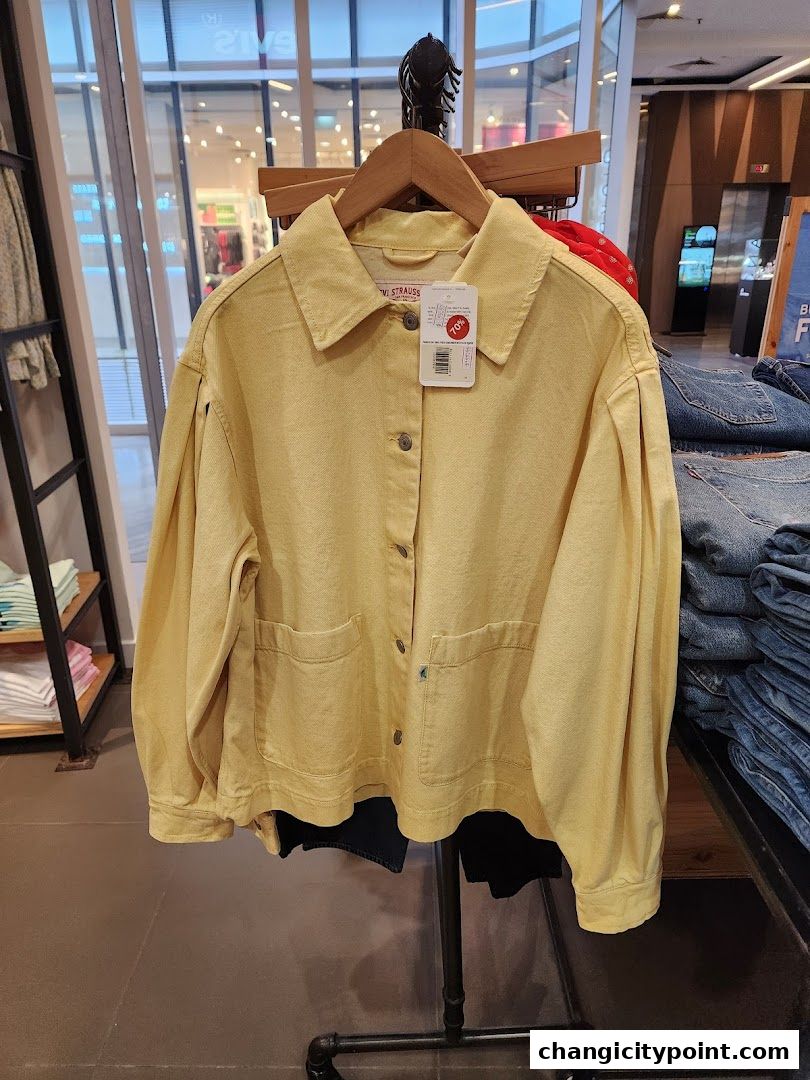A yellow Levi's jacket with a tag showing 70% off is displayed.