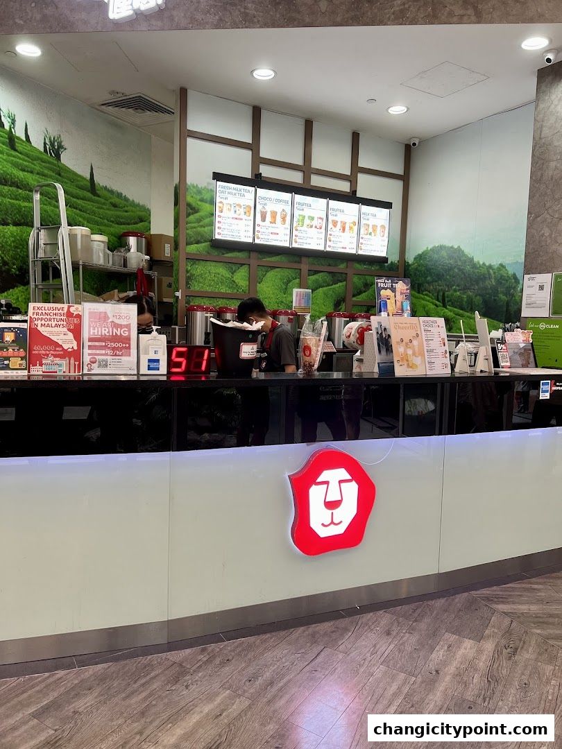 LiHO TEA shop counter with menu boards and staff serving customers.