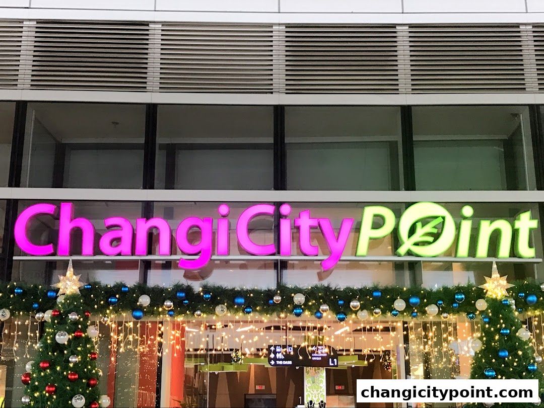 Changi City Point shopping mall entrance decorated for the holidays with Christmas trees and lights.