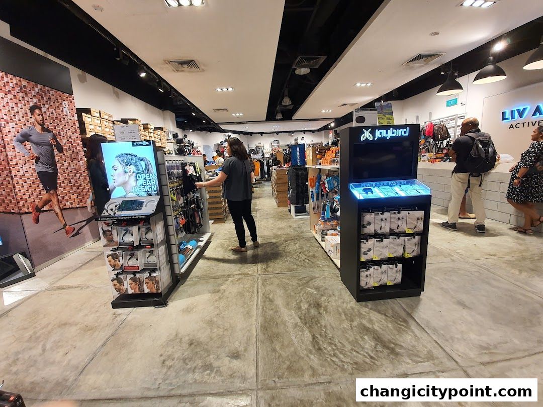 Interior view of Liv Activ Changi City Point store showcasing athletic wear and accessories.