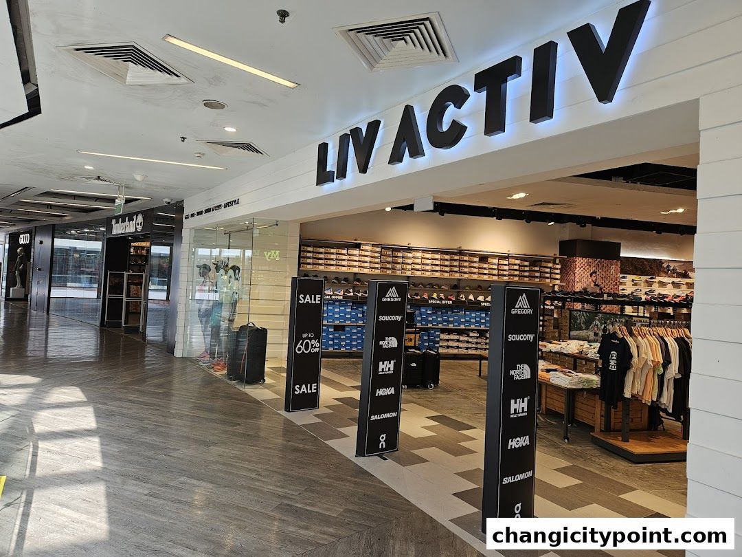 The entrance of Liv Activ, a sports and lifestyle store, showcasing shoes and apparel.