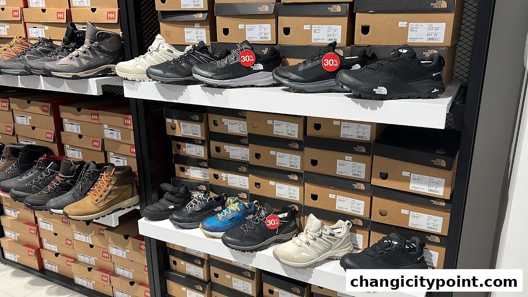 A retail store display featuring a wide selection of hiking and outdoor footwear.