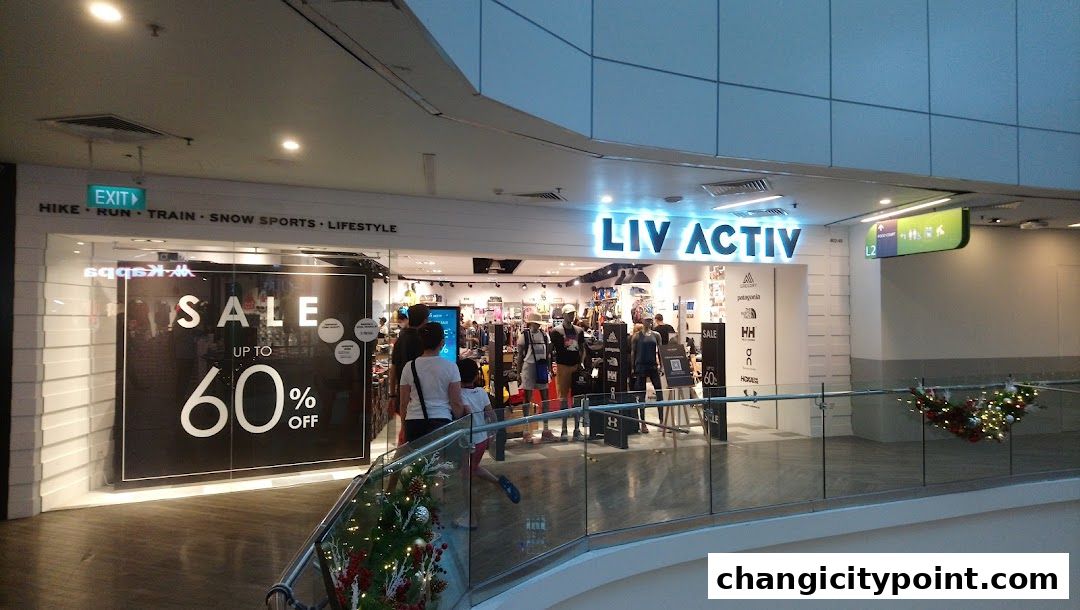 Liv Activ store entrance with a large 'Sale Up To 60% Off' sign and mannequins displaying activewear.