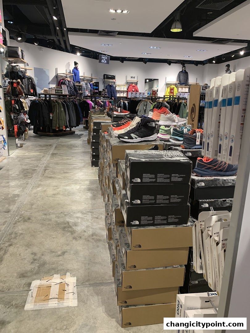 Interior view of Liv Activ Changi City Point store showcasing apparel and footwear.