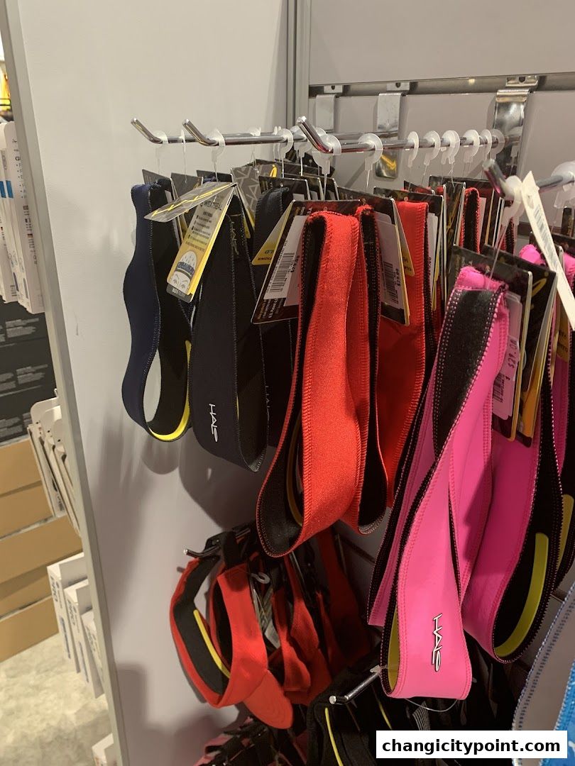 A display of colorful headbands and sweatbands for athletic activities.