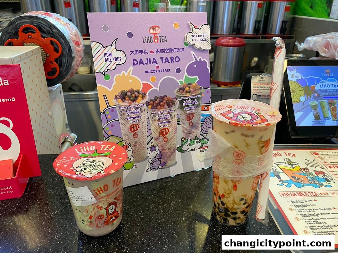 Two LiHO TEA drinks are displayed with promotional material and a menu.