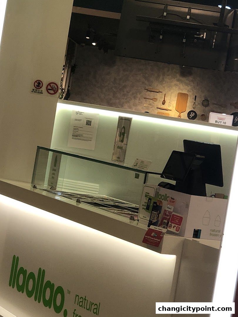 The front counter of a llaollao shop with branding and promotional materials.