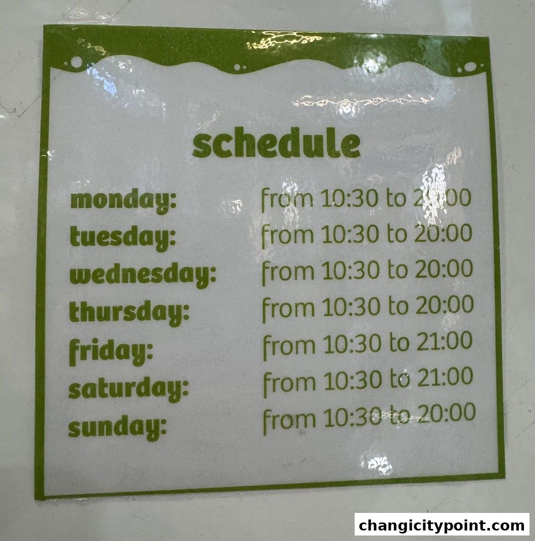 A sign displaying the operating hours for llaollao from Monday to Sunday.