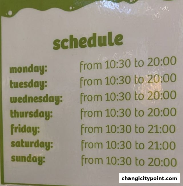 A sign displaying the operating hours for llaollao from Monday to Sunday.
