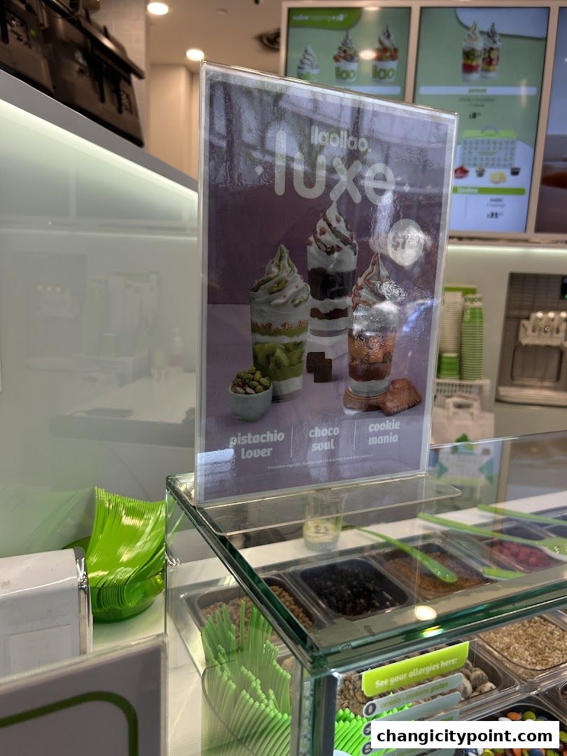 A display of llaollao frozen yogurt desserts with toppings and menu items.