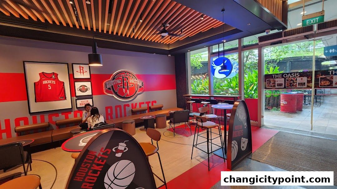 Interior of a Houston Rockets themed Luckin Coffee shop with seating and decor.