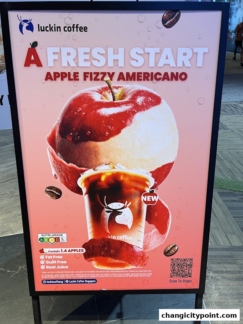 A sign advertising Luckin Coffee's Apple Fizzy Americano with an apple and coffee cup.