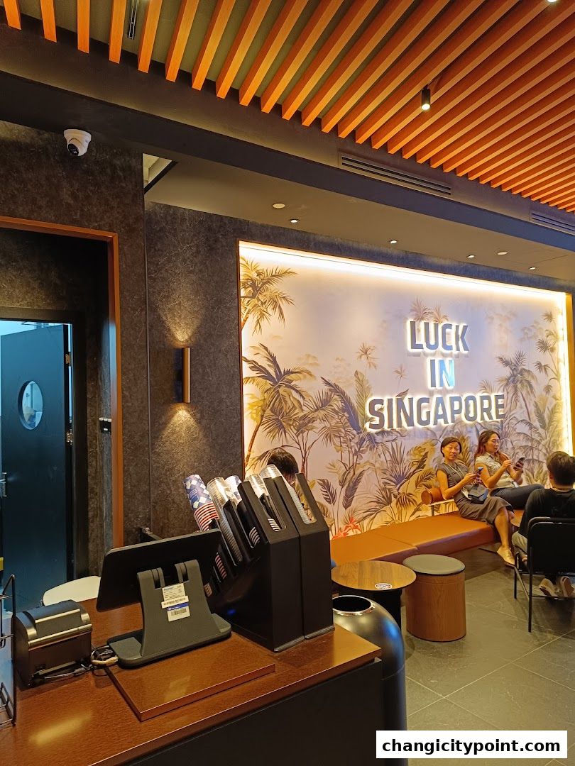 Interior of Luckin Coffee with a counter, seating area, and tropical mural.
