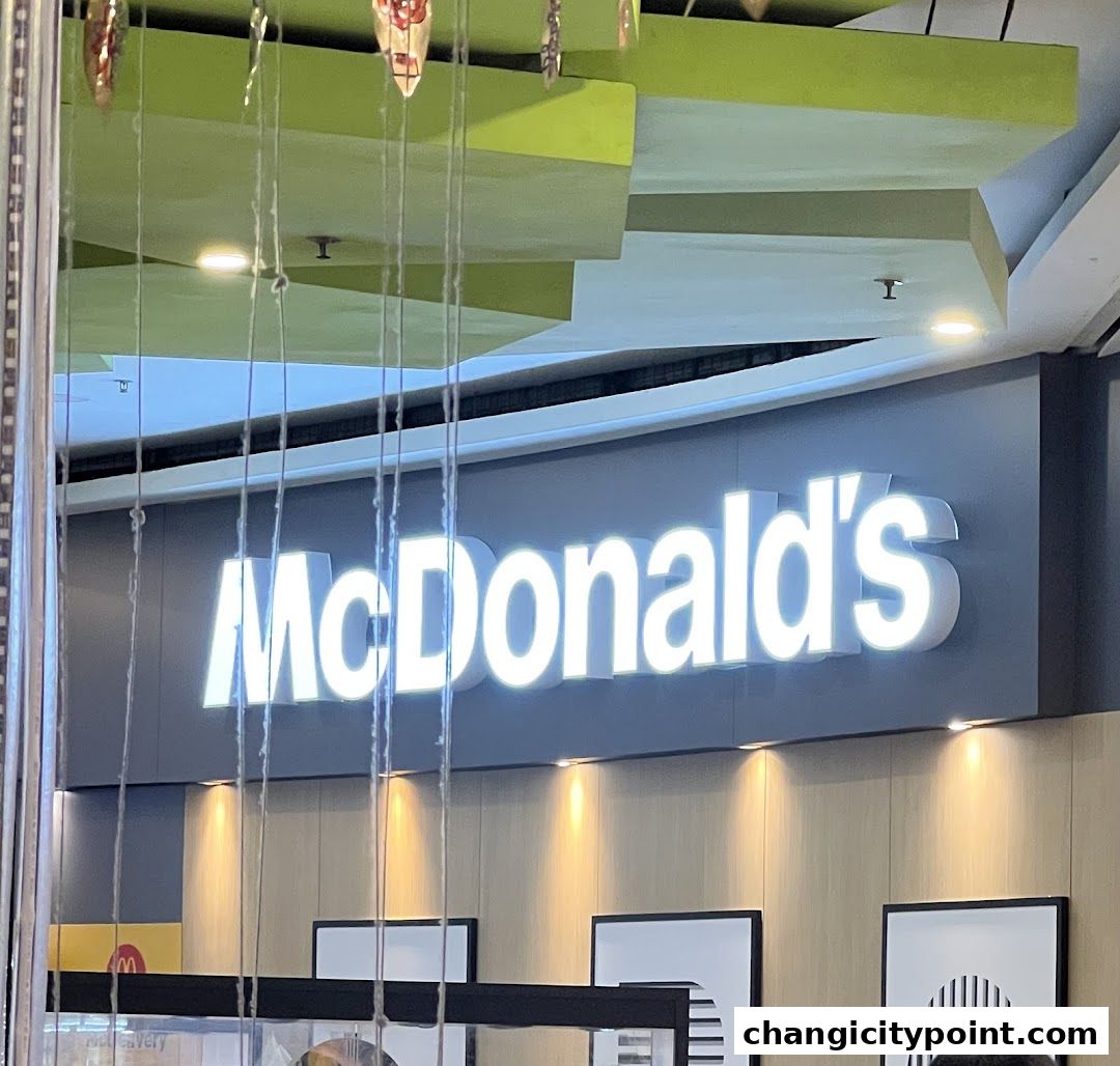 The illuminated McDonald's logo is displayed prominently on the shop's facade.