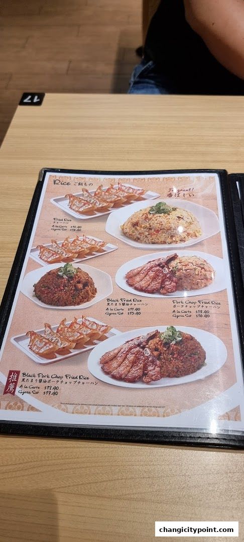 A menu page showcasing various fried rice dishes with pork chops and gyoza.