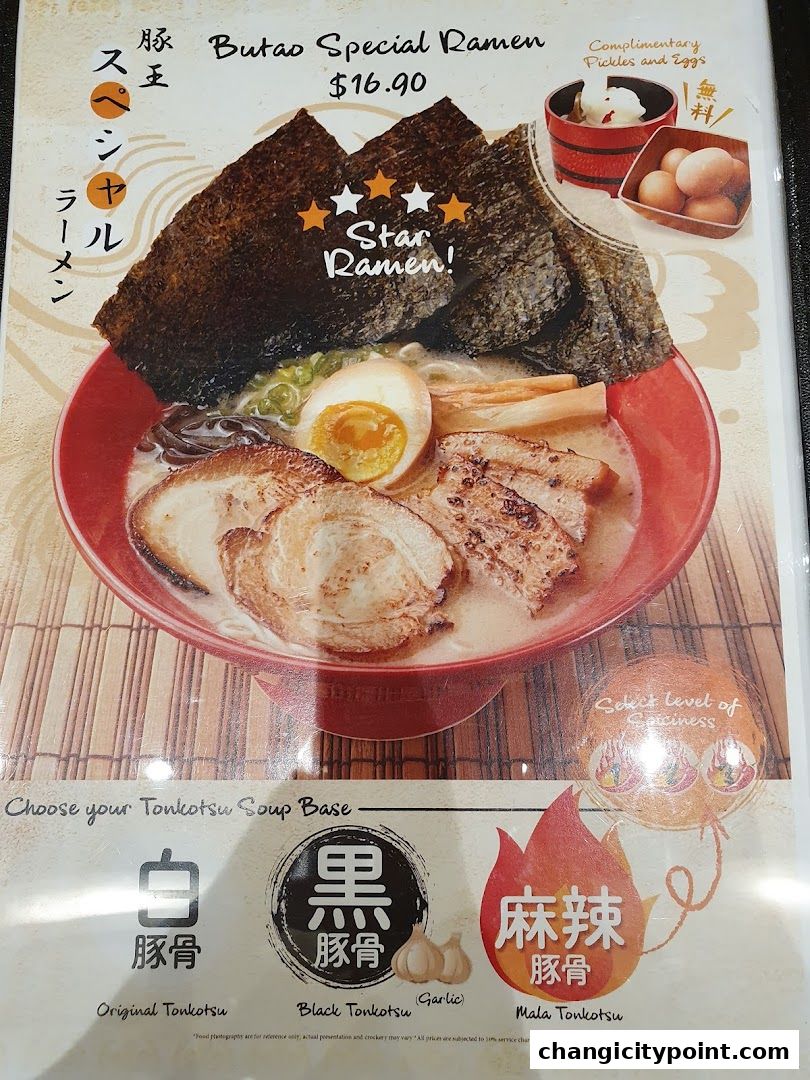 A bowl of Butao Special Ramen with complimentary pickles and eggs.