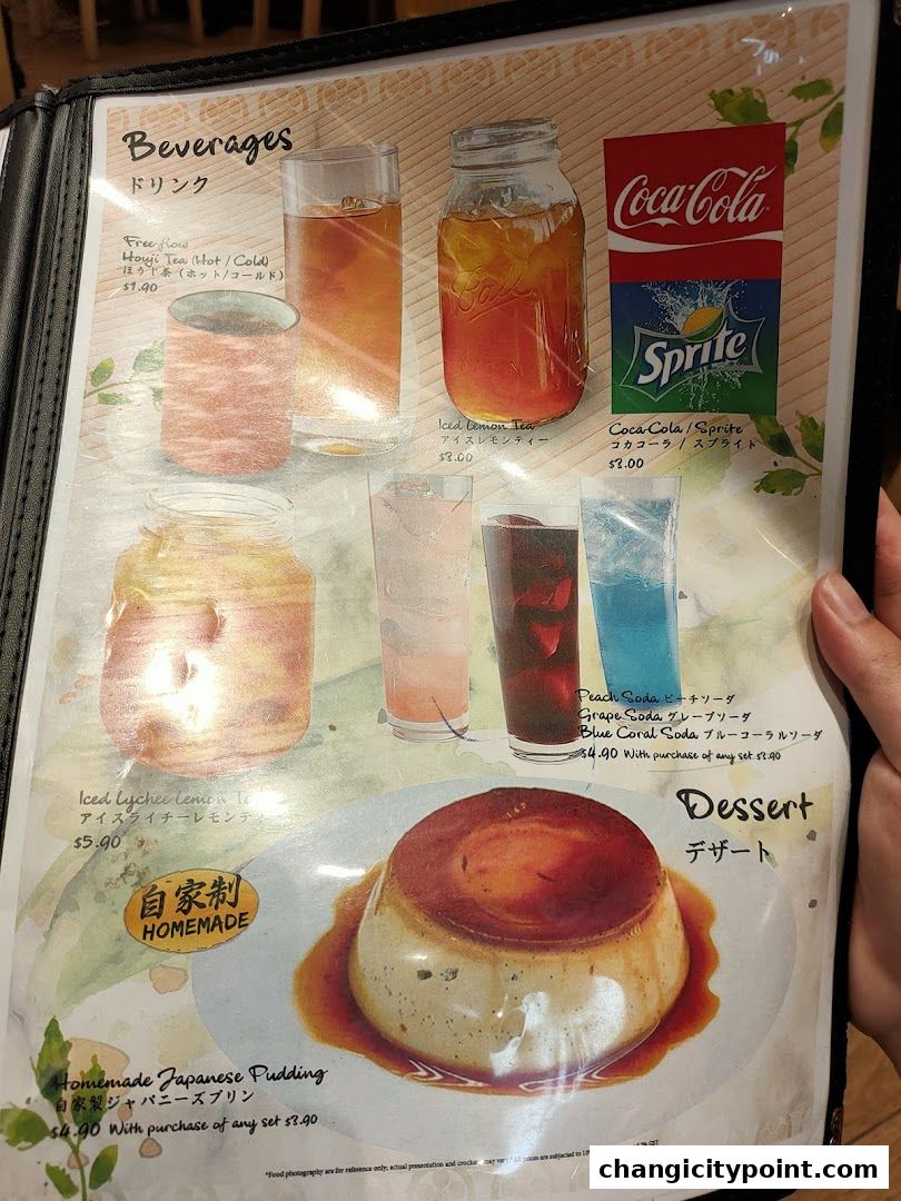 A menu page featuring beverages like tea and soda, and a homemade Japanese pudding dessert.