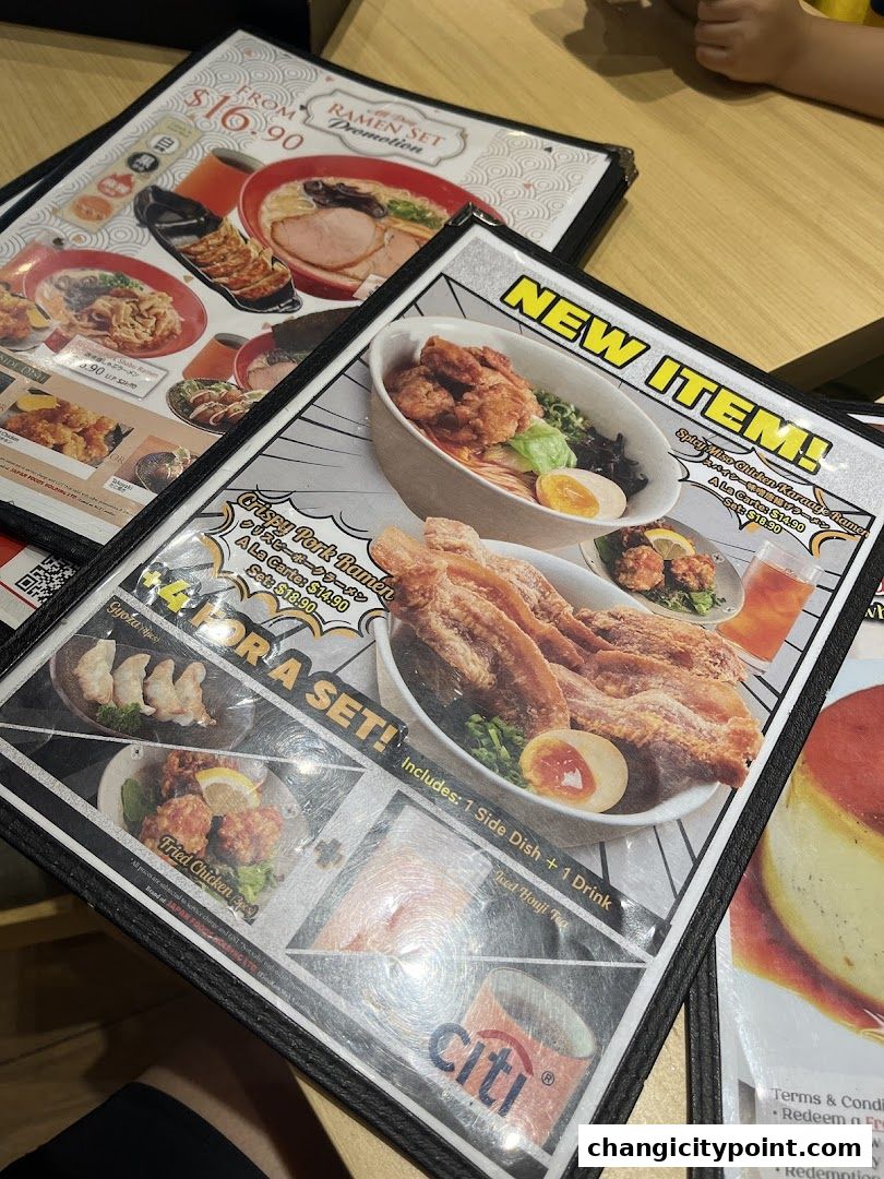 A menu featuring ramen, fried chicken, gyoza, and drinks from Menzo Butao.