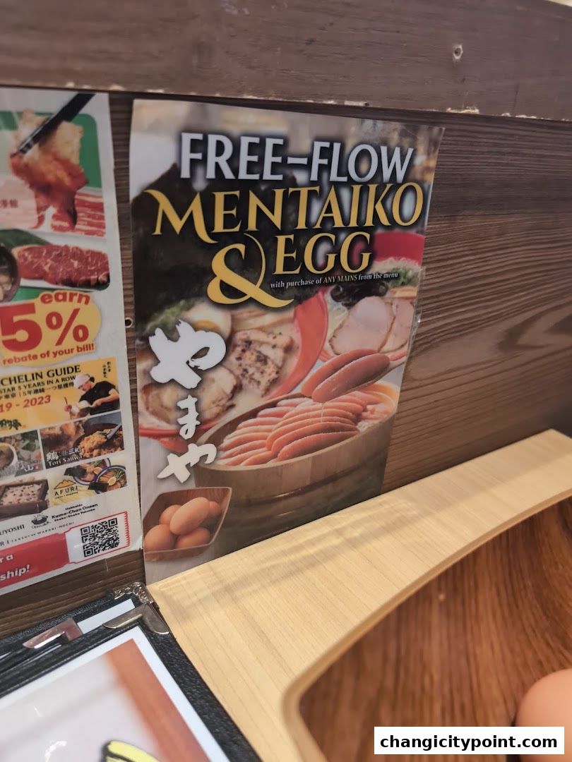 A promotional poster for free-flow mentaiko and egg with purchase of any main dish.