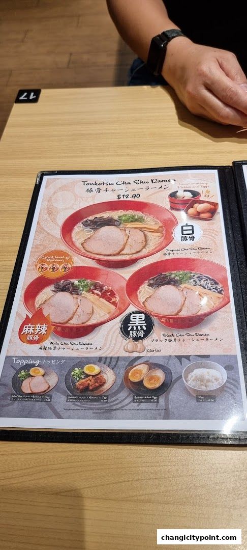A menu showcasing different ramen bowls and toppings from Menzo Butao.