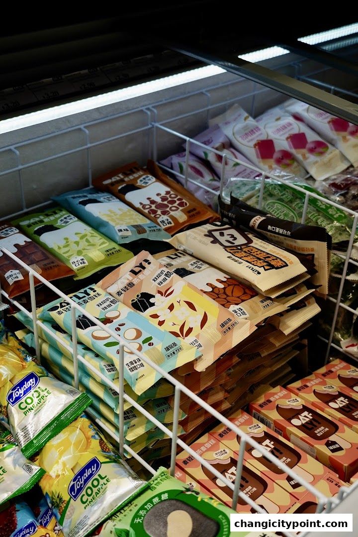 A freezer display filled with various ice cream bars and frozen treats.
