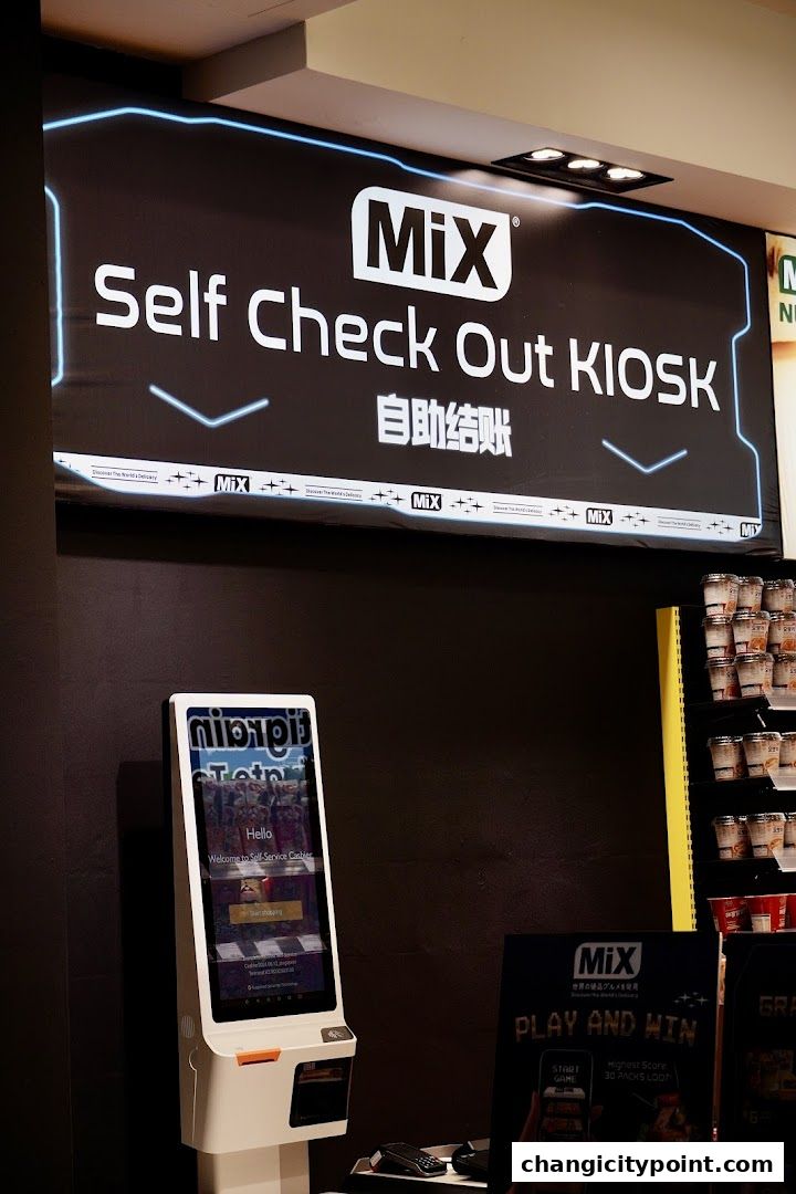 MiX Self Check Out KIOSK with a touch screen and products on shelves.