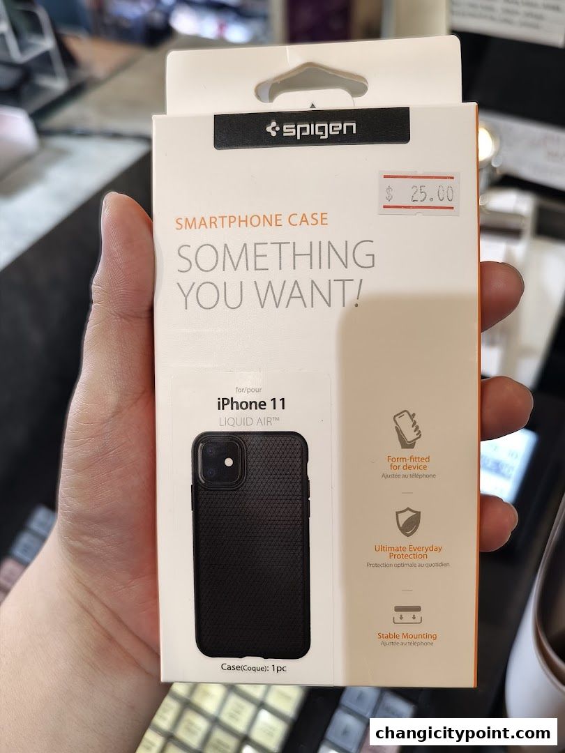 A hand holds a Spigen smartphone case for iPhone 11 Liquid Air.