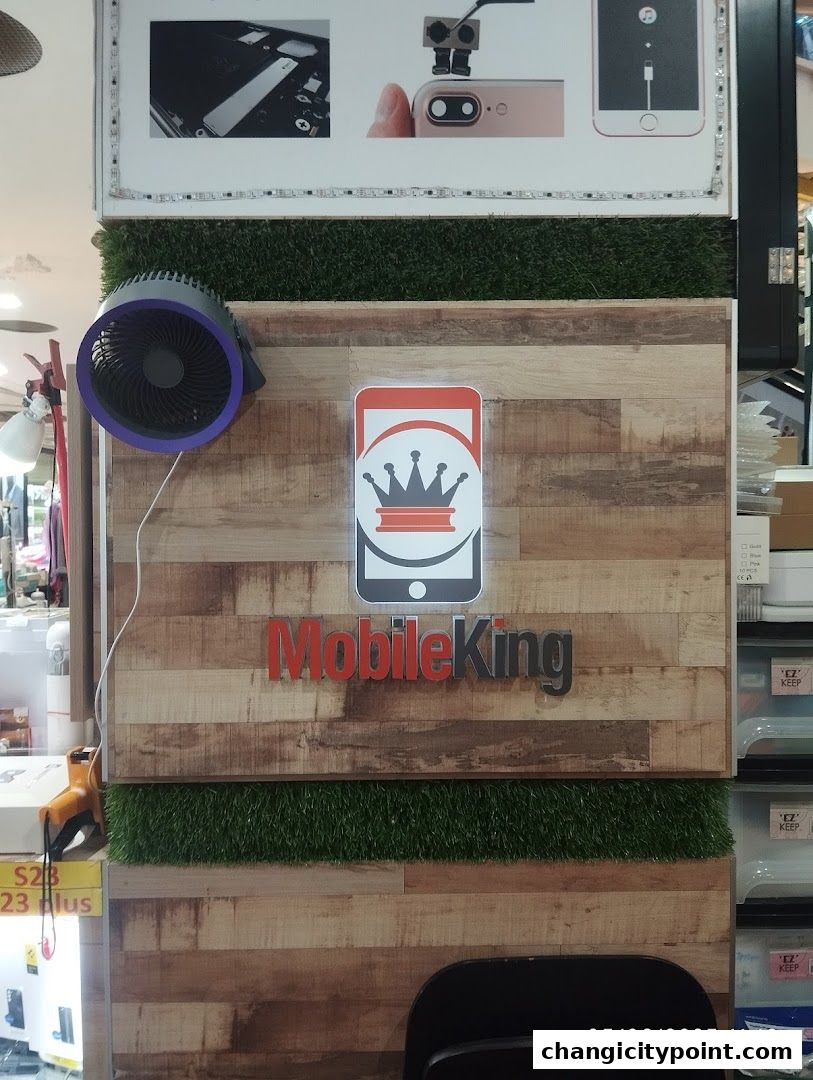 Mobile King shop interior with logo, fan, and product displays.