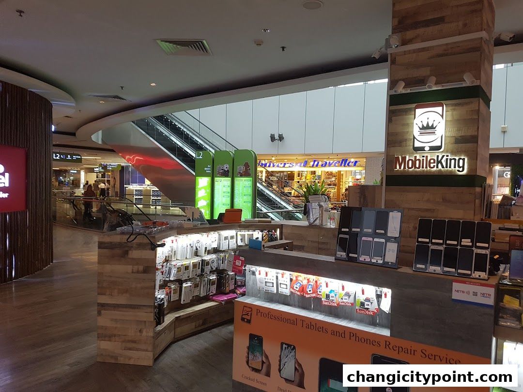 Mobile King shop display with phones, accessories, and repair service advertisement.