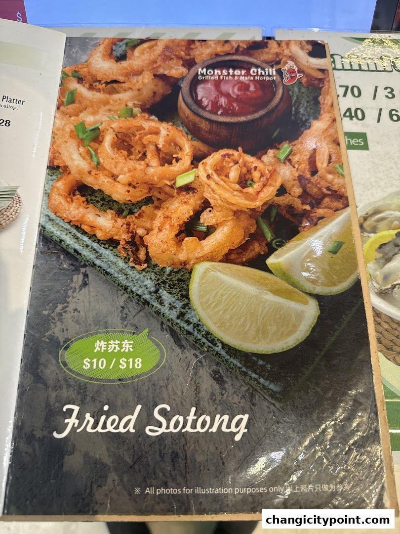 A menu page featuring a close-up of crispy fried calamari (sotong) with lime wedges and a dipping sauce.