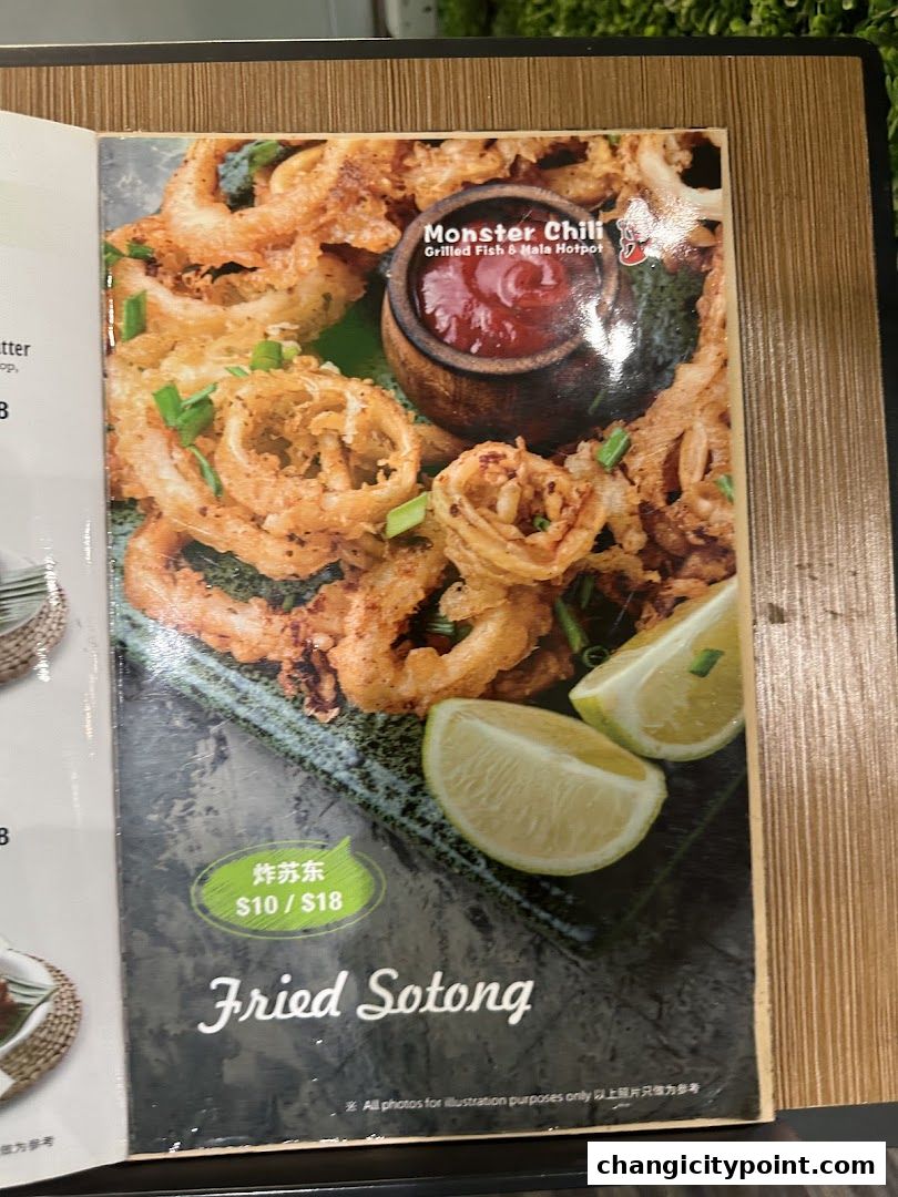A menu page featuring a close-up of crispy fried sotong with a dipping sauce and lemon wedges.