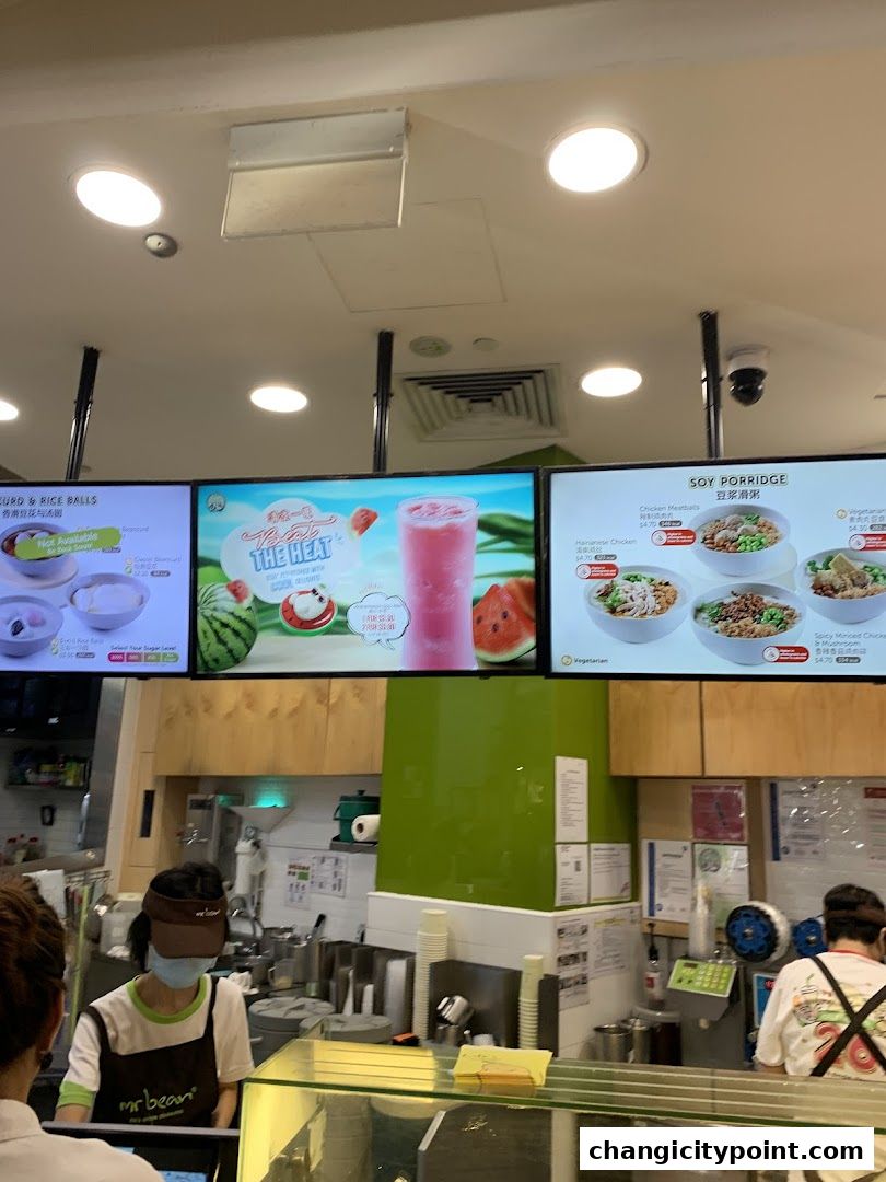 Digital menu boards display food and drink options at Mr Bean.
